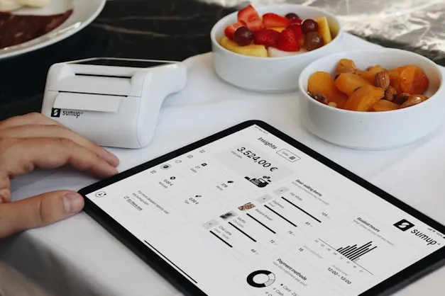 A laptop showing a restaurant’s customer and order records